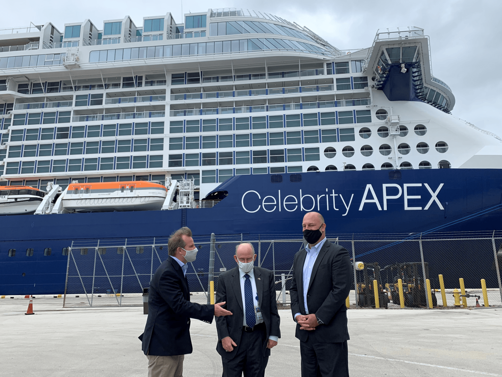 Commissioner Louis Sola (L) speaks with Jonathan Daniels (R) and Glenn Wiltshire (C), both of Port Everglades. The Celebrity Apex, delivered earlier this year, is homeported at the facility for the winter.