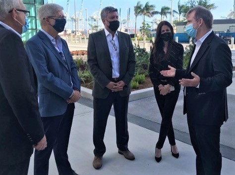 Commissioner Louis Sola (Right) speaks with (L-R) Juan Kuryla (PortMiami) Steve Moeller (Norwegian Cruise Holdings), Luis Rocha (NV2A Group), and Hydi Webb (PortMiami) outside of NCL Cruise Terminal