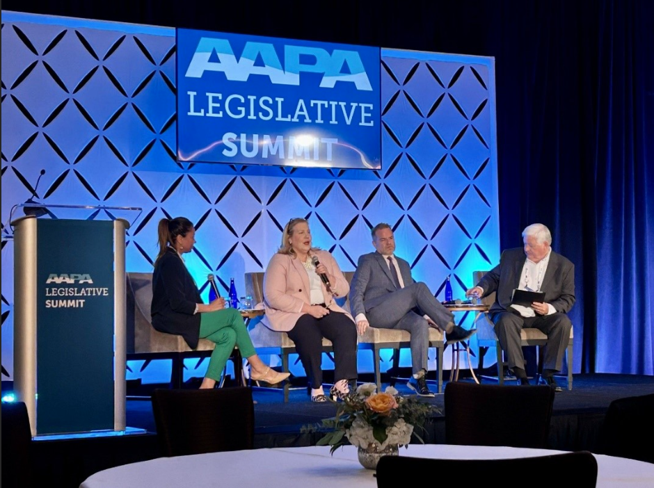 4 panelists sitting on a stage in front of a AAPA Legislative Summit backdrop